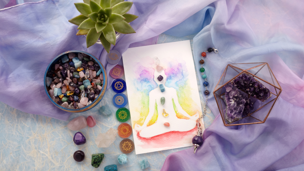 Chakra healing setup with colorful crystals, amethyst, and meditation art symbolizing Reiki energy balance and holistic wellness at Finding InnerSelf in India.